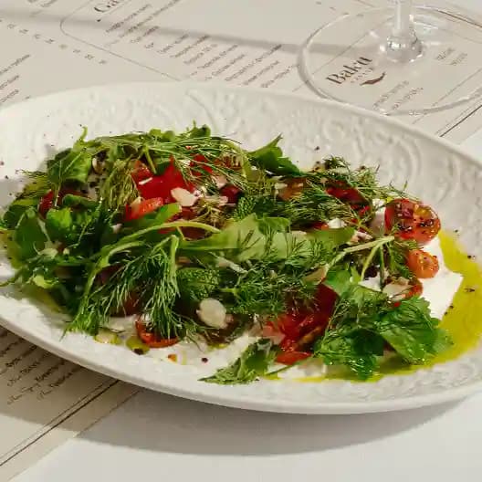 meals/20260721102312-a-mix-of-tomatoes-stracciatella-and-tarragon-oil.webp