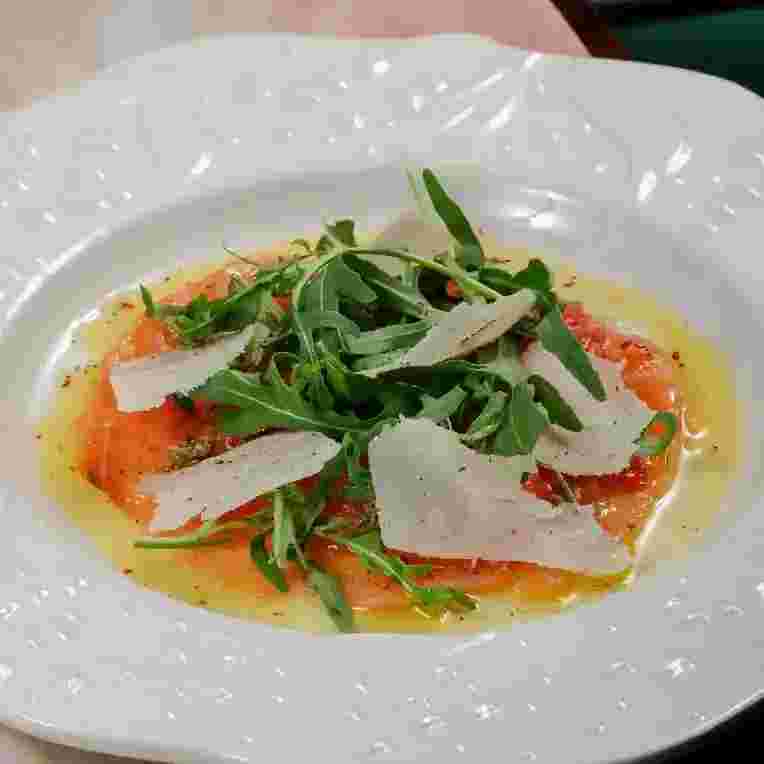 salmon-carpaccio-arugula-and-parmesan.webp